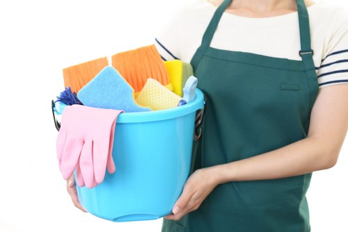 Carpet cleaners preparing equipment in a safe property setting