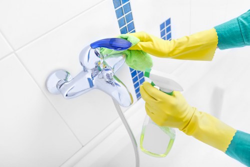 Professional gutter cleaning access equipment in a North London street