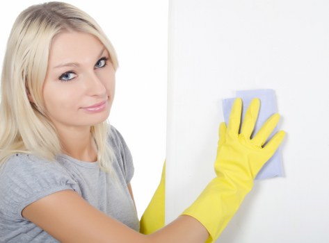 Professional carpet cleaning team following safe working practices